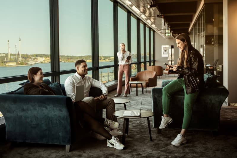 Coworking in Stockholm People at a coworking space in Stockholm with panoramic view over the city